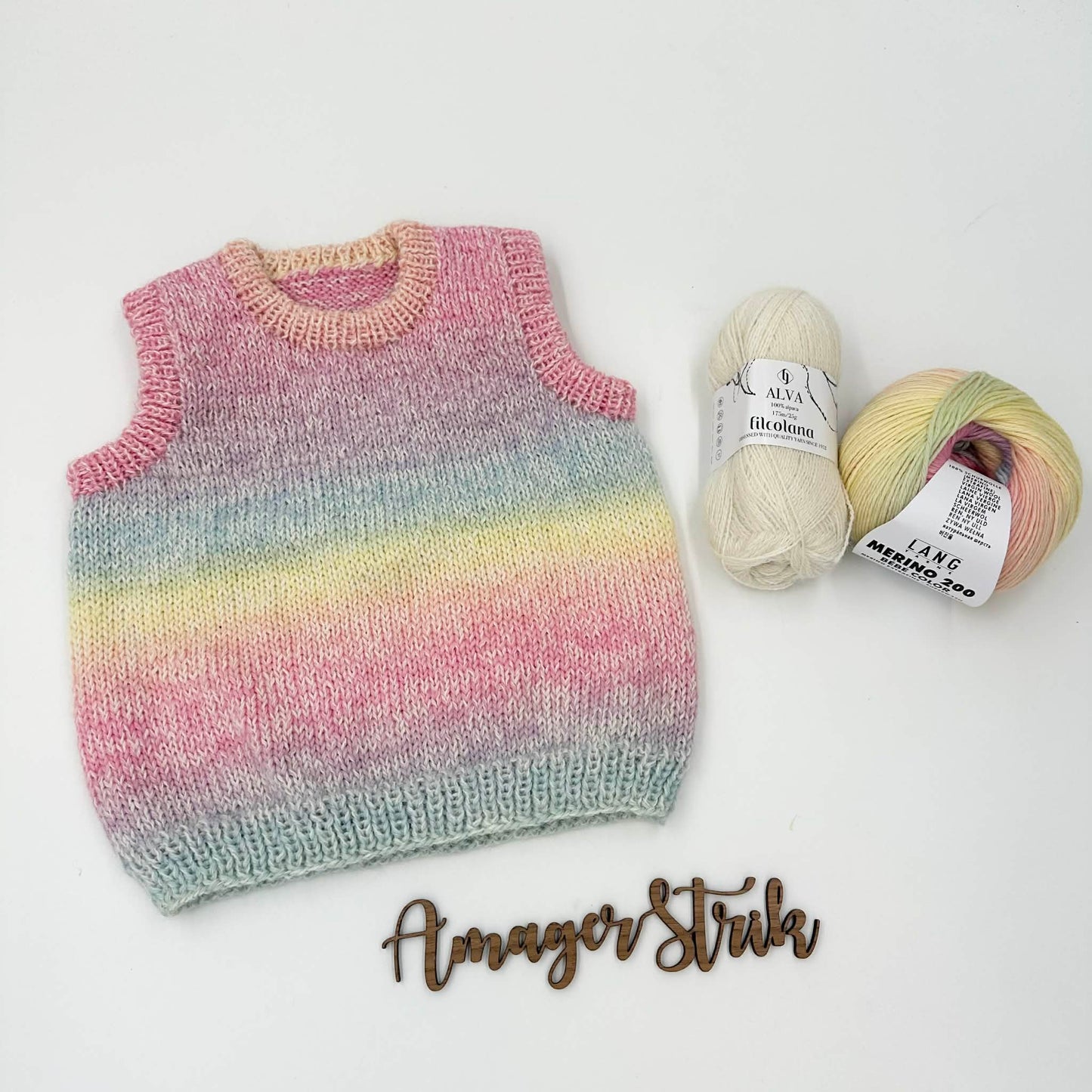 Regnbuevest str. 12/18 mdr i Merino bebe og Alva